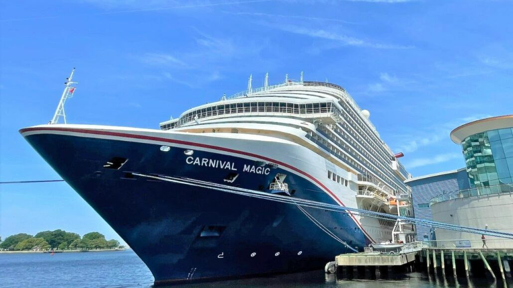 A large cruise ship docked at a port.