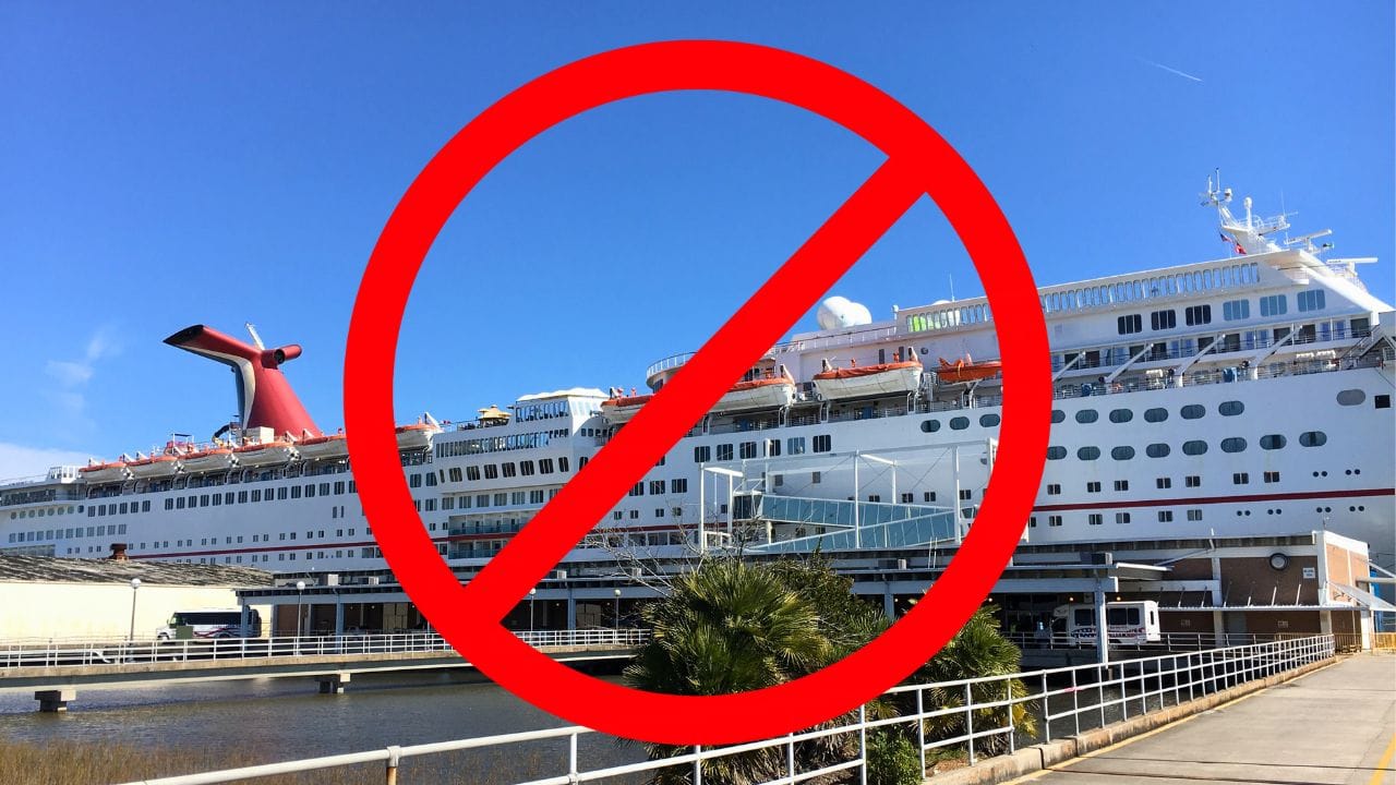 Image of a cruise ship docked at the Charleston Cruise Port with a large red prohibition symbol superimposed over it, indicating the Proposal Denied on cruising activities.