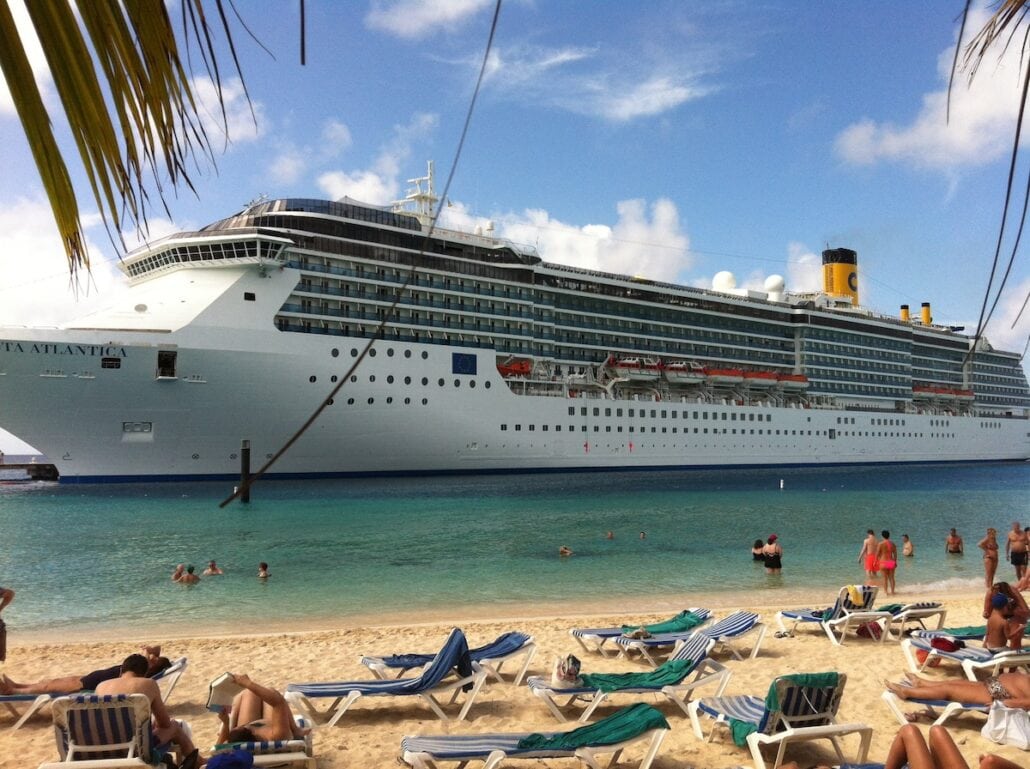 The Costa Atlantic docked at the Grand Turk cruise center on a sunny day.