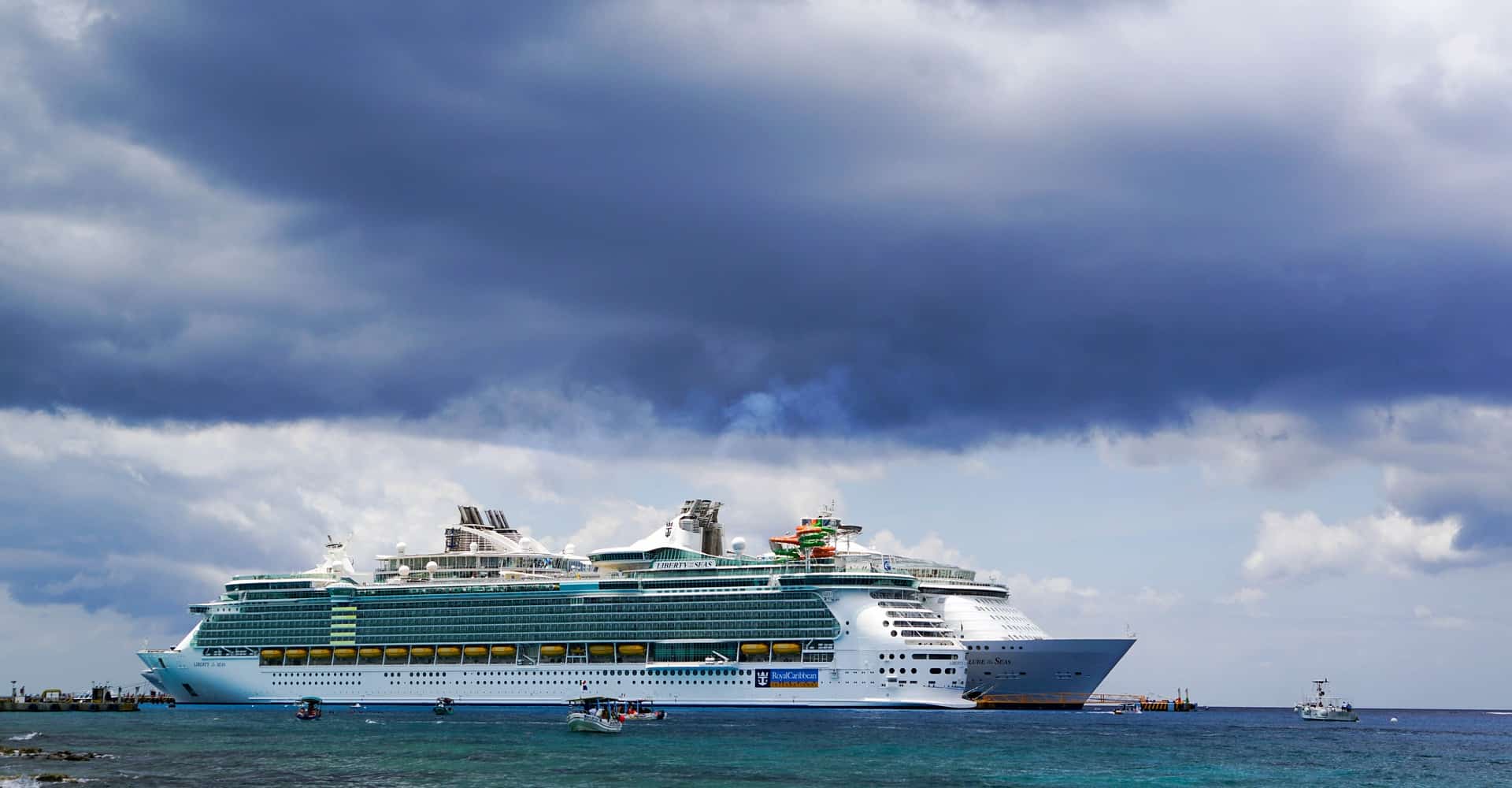 cruise ship on the sea with cloudy skies