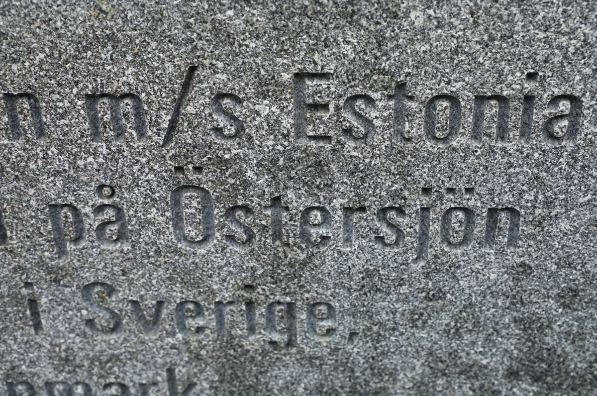 Close-up photo of an engraved stone featuring Swedish text with the words 