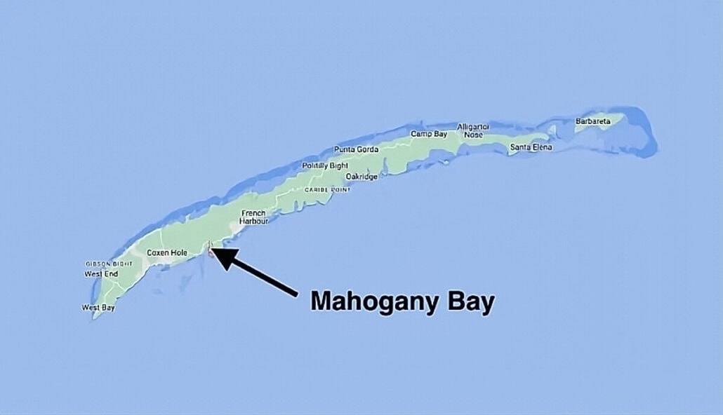 A map showing Roatán Island with various locations marked, including Mahogany Bay, which is highlighted with a black arrow.