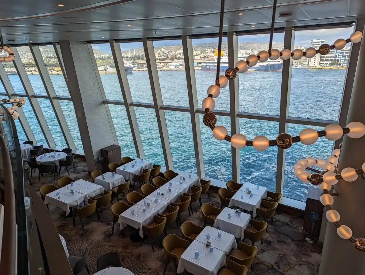 Modern Sun Princess restaurant interior with sea views through large windows.