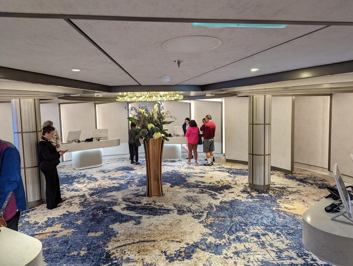 Guests checking in at the Sun Princess hotel lobby with a modern design.