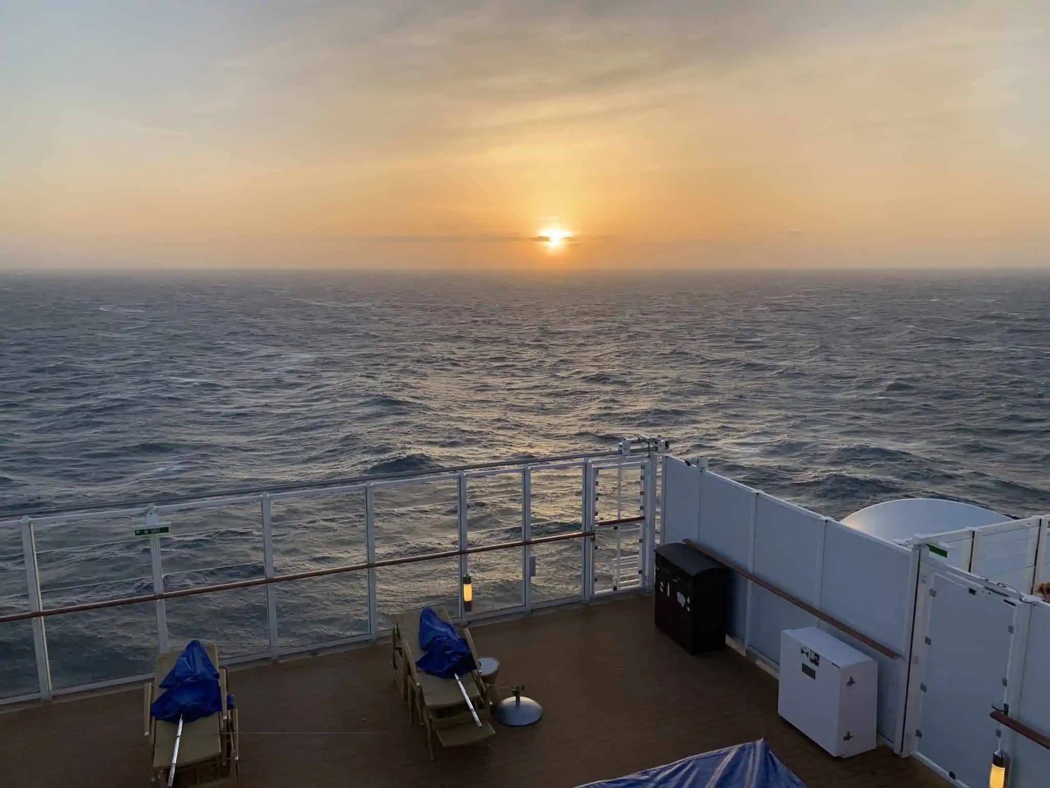 A view of the ocean from the deck of a cruise ship.